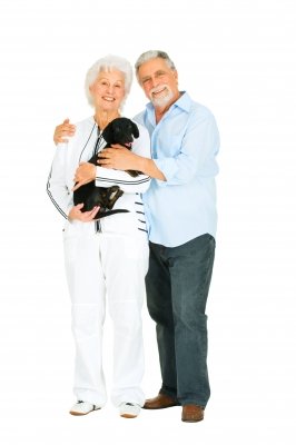 senior citizen couple with dog