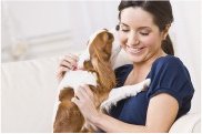 photo of a woman cuddling a dog